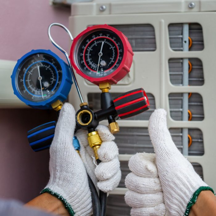 technician-man-giving-thumbs-up-repairman-fixing-air-conditioning-system